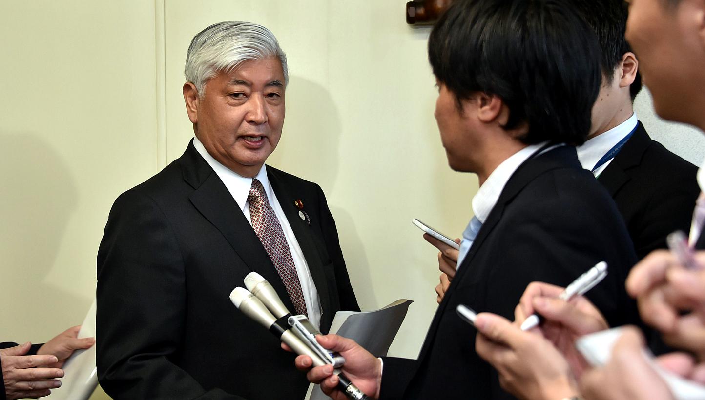 Japanese defence minister, Gen Nakatani (left), speaking to the press in Tokyo on March 30, 2015. -- PHOTO: AFP&nbsp;