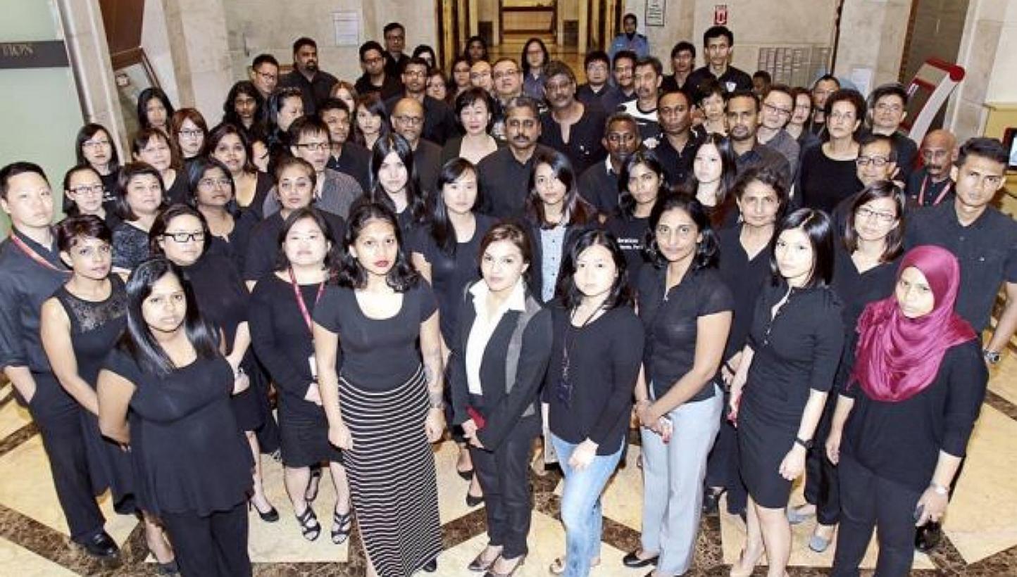 Journalists in media houses around Malaysia, including those from The Star (pictured), turned up for work in black, in a show of solidarity with online portal The Malaysian Insider (TMI) over the recent arrests of its editors and publisher. -- PHOTO: