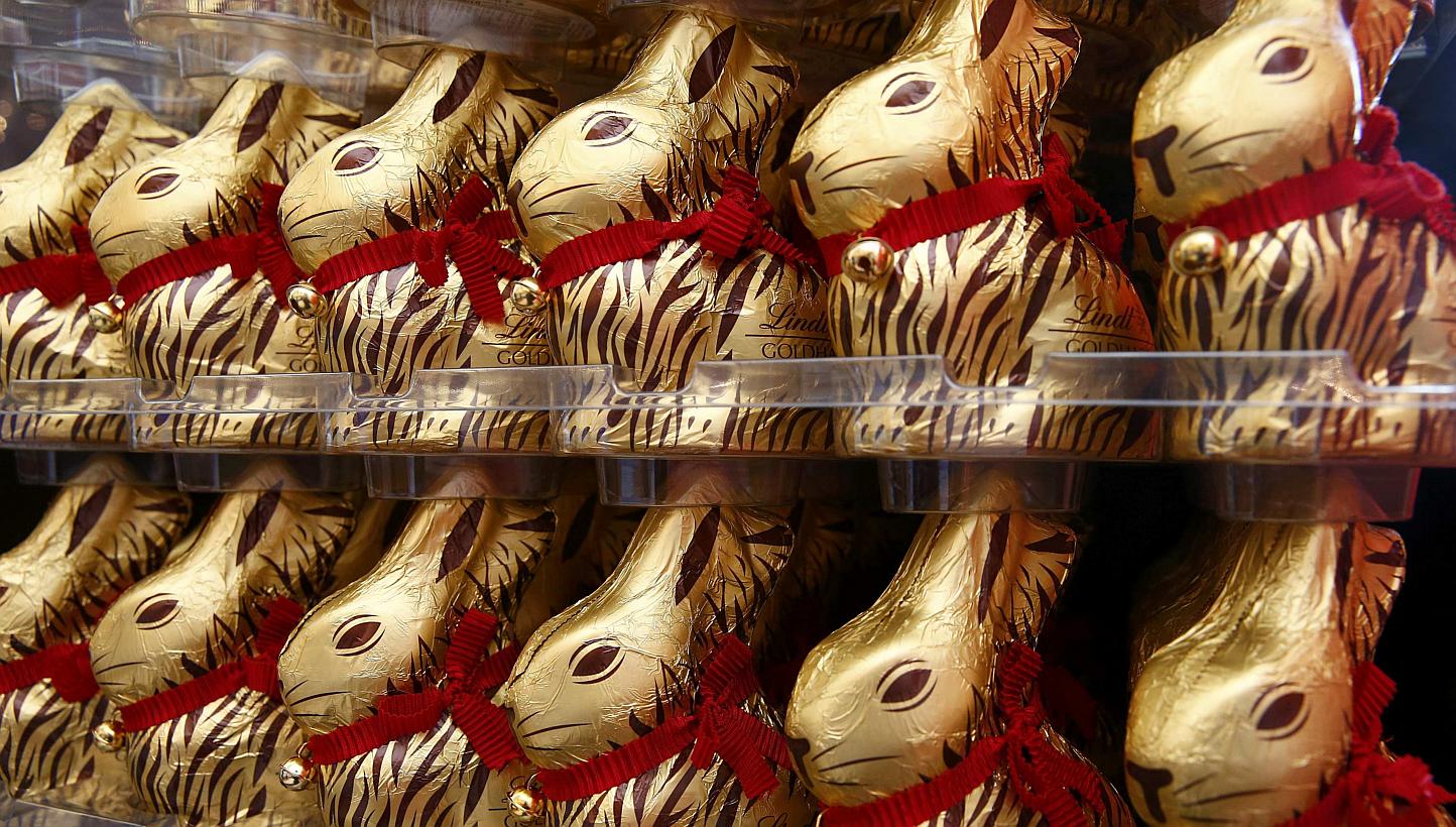 Gold-wrapped Easter chocolate bunnies are displayed during the annual news conference of Swiss chocolatier Lindt & Spruengli in Kilchberg near Zurich on March 10, 2015. --PHOTO: REUTERS