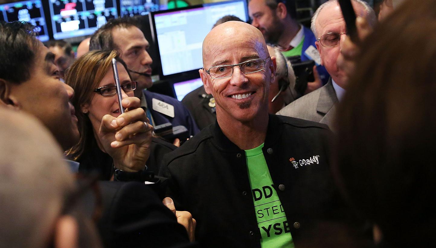 GoDaddy chief executive officer Blake Irving visits the floor of the New York Stock Exchange as the website hosting service makes its initial public offering on April 1, 2015 in New York City. -- PHOTO: AFP
