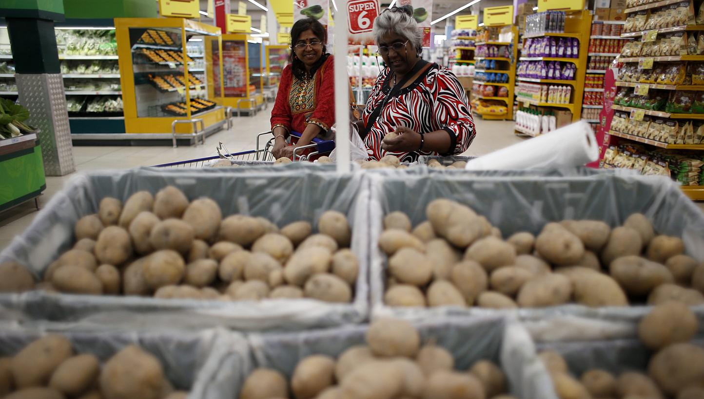 Two women shopping in a supermarket at Shah Alam, outside Kuala Lumpur, &nbsp;on April 1, 2015. Malaysia joined the ranks of 160 other countries globally in embracing the Goods and Services Tax (GST). Under the new GST, consumers will be charged a fl