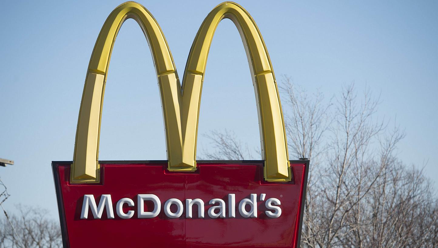 A McDonalds fast-food restaurant in Alexandria, Virginia.&nbsp;McDonald's announced Wednesday that it would increase wages for 90,000 employees in company-owned restaurants in the United States, as well as offering them paid time-off. -- PHOTO: AFP