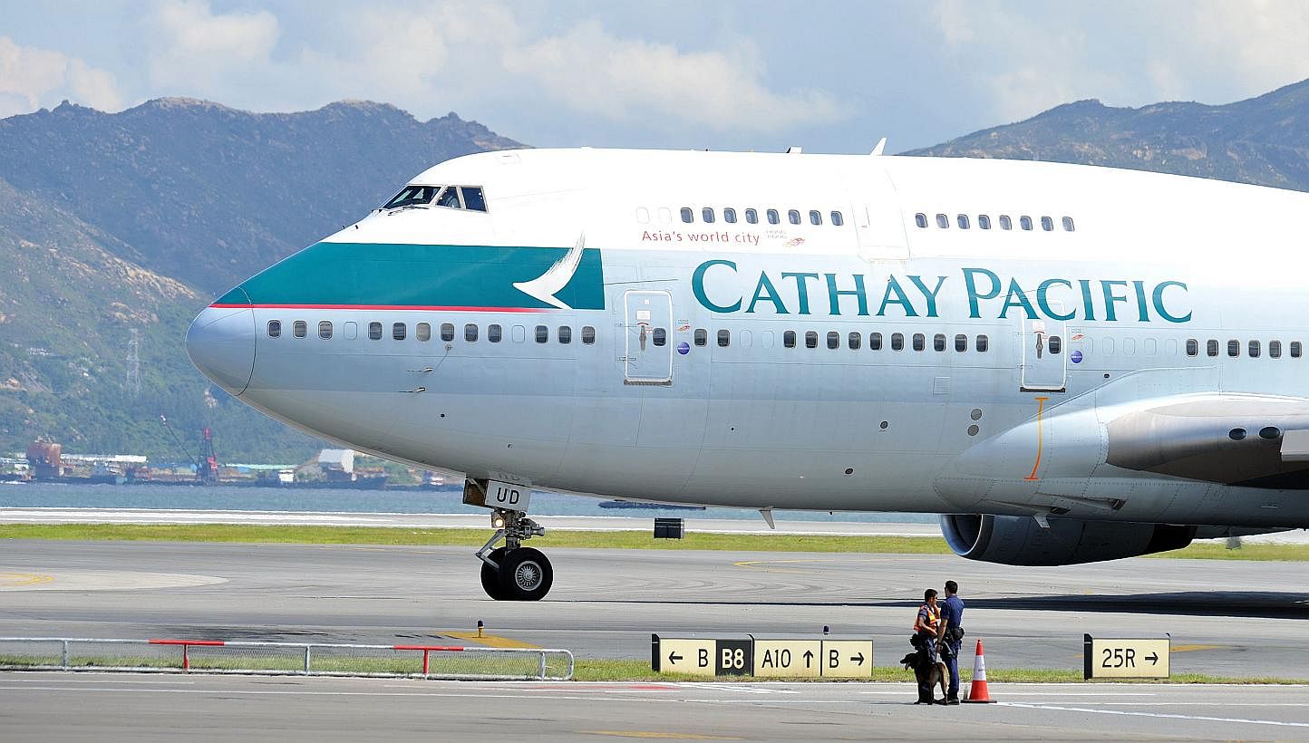 A Cathay Pacific Boeing 747 passenger plane taxis upon landing at Hong Kong's international airport on Aug 6, 2011. An artist has pleaded not guilty in a Hong Kong court over allegations of assaulting a flight attendant on a Cathay Pacific flight fro