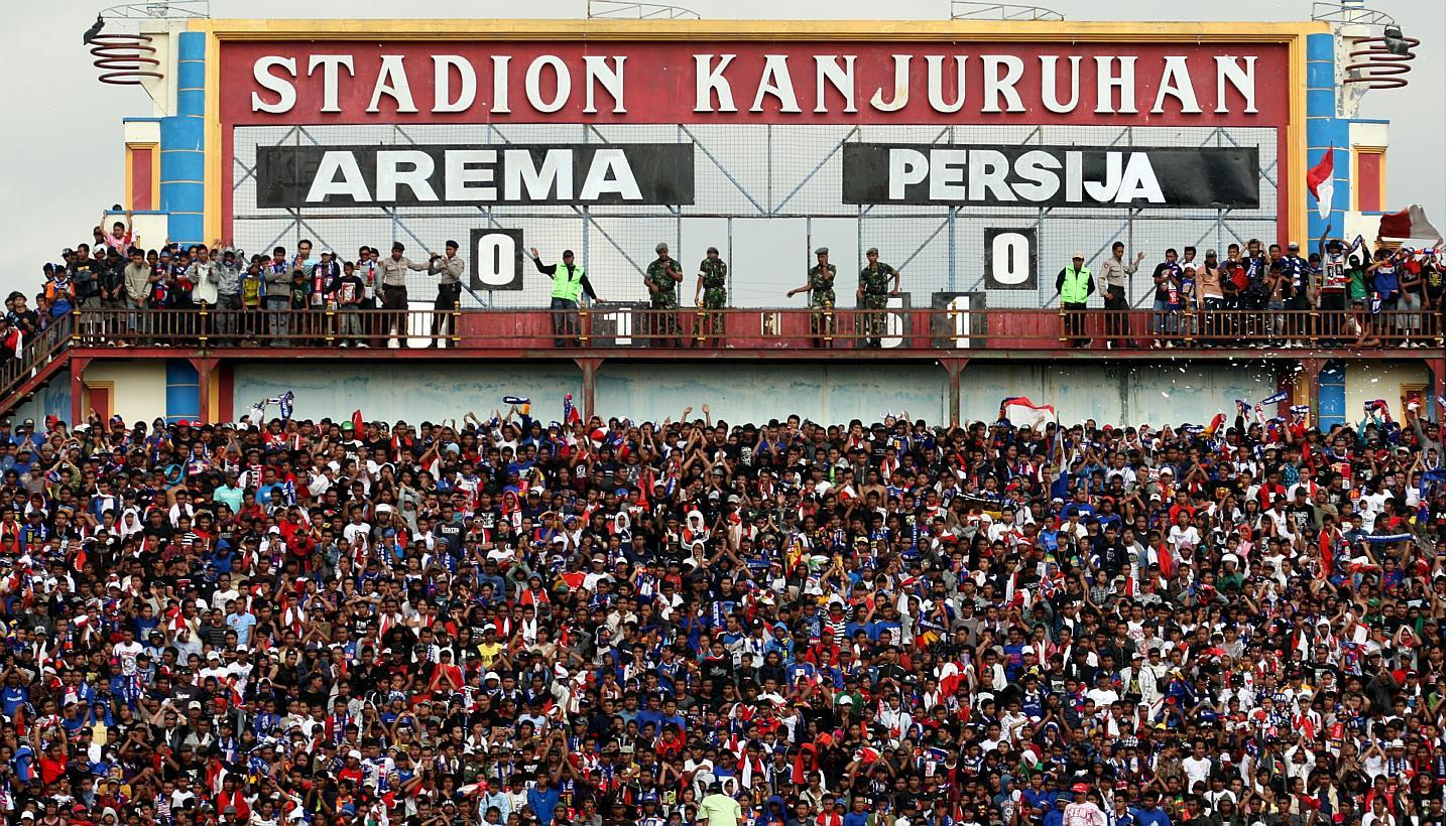 The Aremania, as fans of Indonesian Super League (ISL) football club Arema Malang are called, showing their support during an ISL match against Persija on Oct 11, 2009, at the Kanjuruhan Stadium in Malang, Indonesia. The league has been plagued by pr