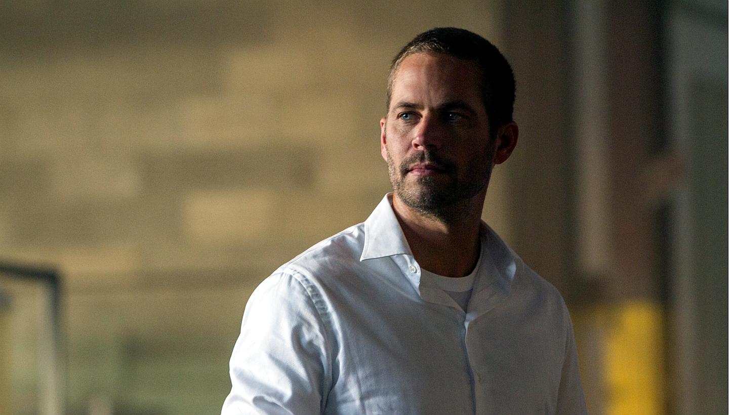 Paul Walker's death in November 2013 led to a temporary halt in production of Fast & Furious 7, the latest movie in the successful series about illegal street racing that helped popularise his career. -- PHOTO: UIP