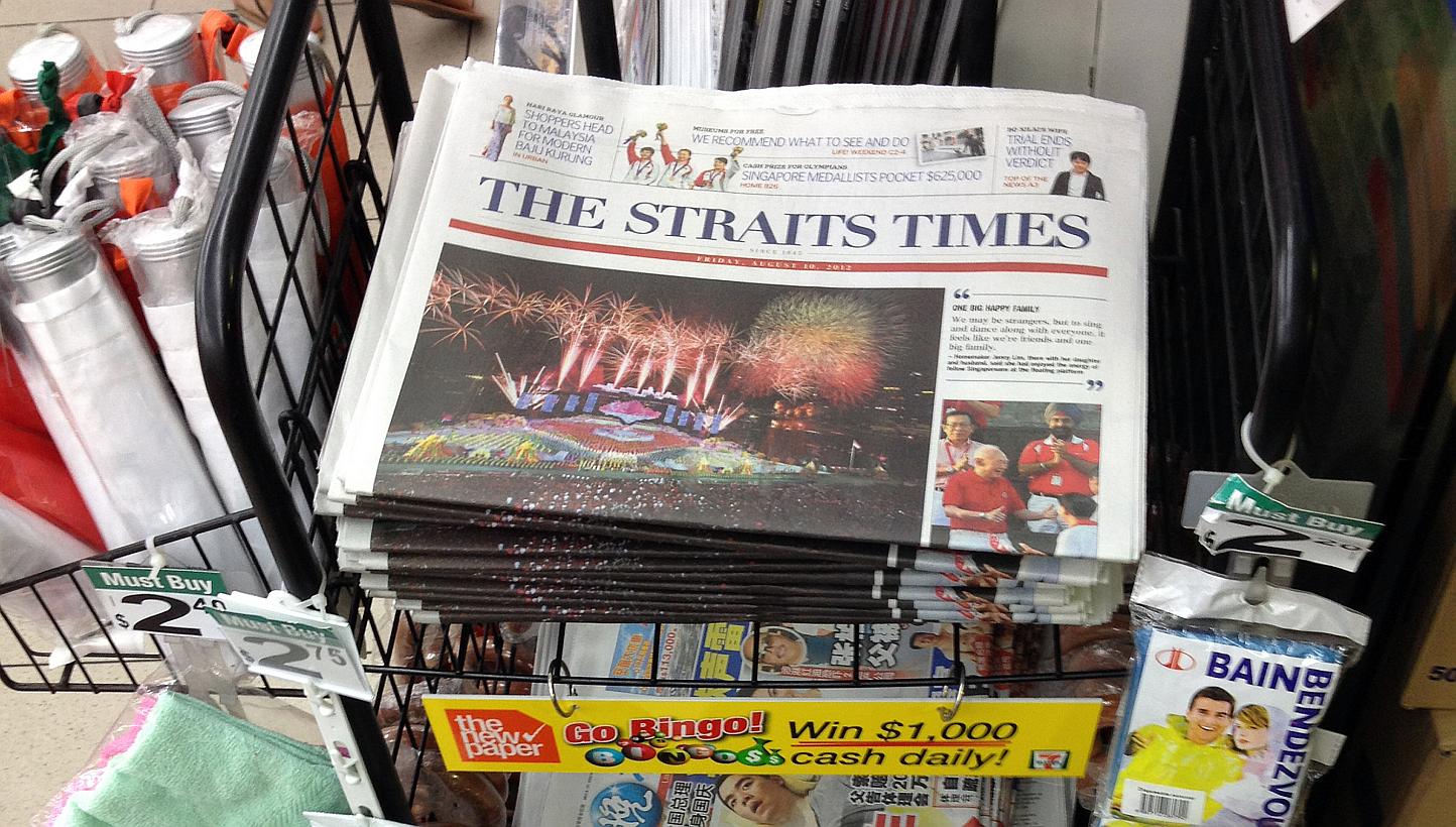 A rack displaying copies of The Straits Times at a Shell petrol station on Braddell Road. -- PHOTO: ST FILE