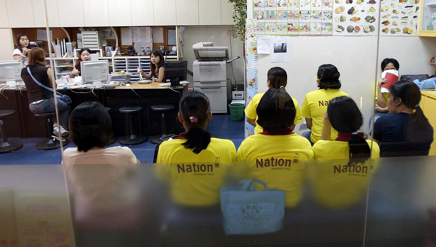 Maids at a maid agency in Hougang Green mall. -- PHOTO: ST FILE