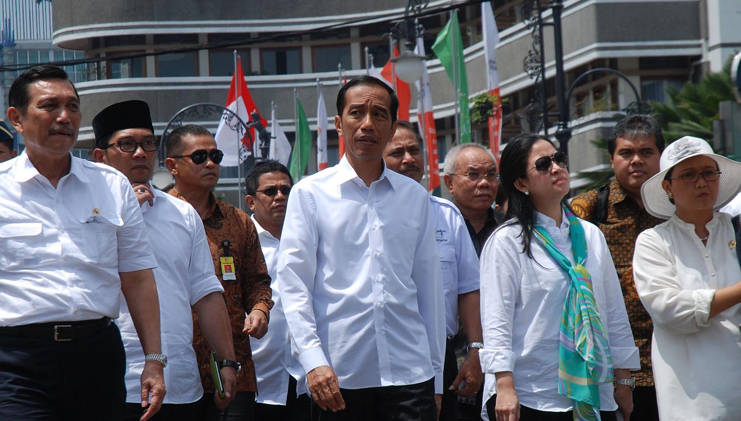 The writer, Chief of Staff Luhut Pandjaitan (far left), accompanying Indonesian President Joko Widodo (centre), Coordinating Minister for Human Development and Culture Puan Maharani (front row, second from right), Foreign Minister Retno Marsudi (far