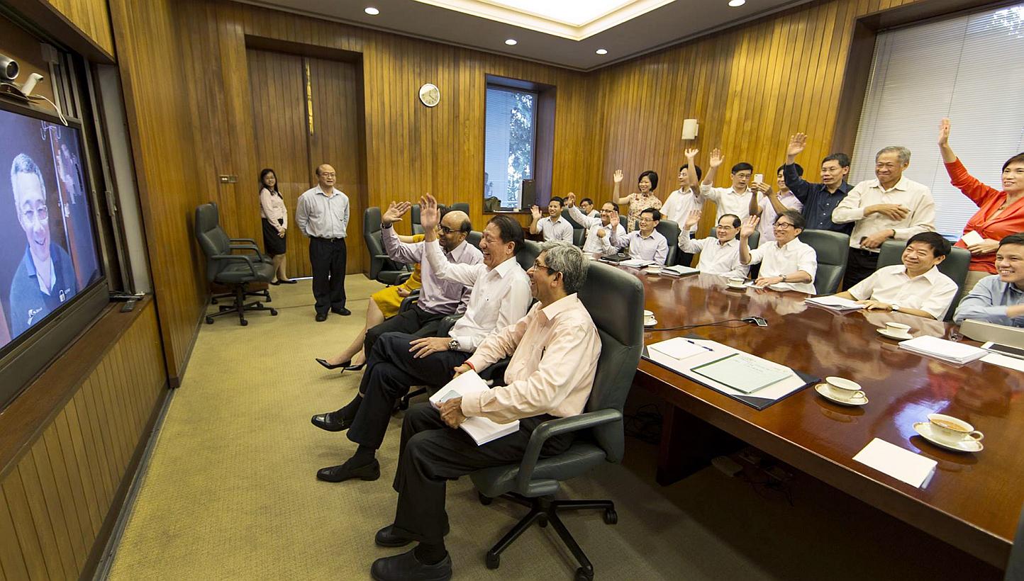 Cabinet members, led by DPM Teo Chee Hean, greeting PM Lee Hsien Loong, who had undergone prostate cancer surgery, via a video-link from the Cabinet room at the Istana on Feb 17. PM Lee’s health scare, and that of then Manpower Minister Tan Chuan-J