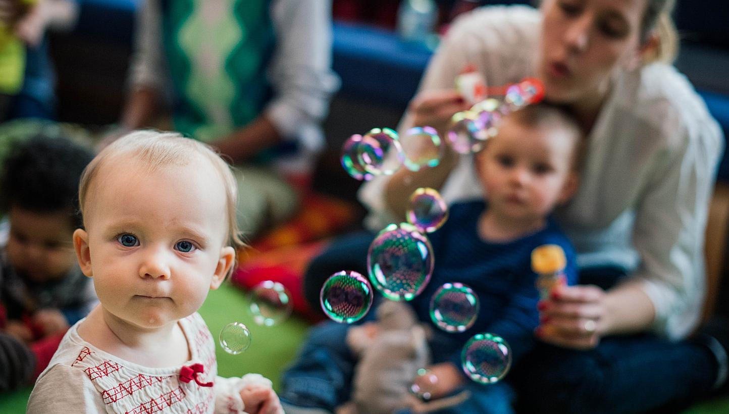 Mothers with their babies meeting at Sollentuna library, north of Stockholm. -- PHOTO: AFP