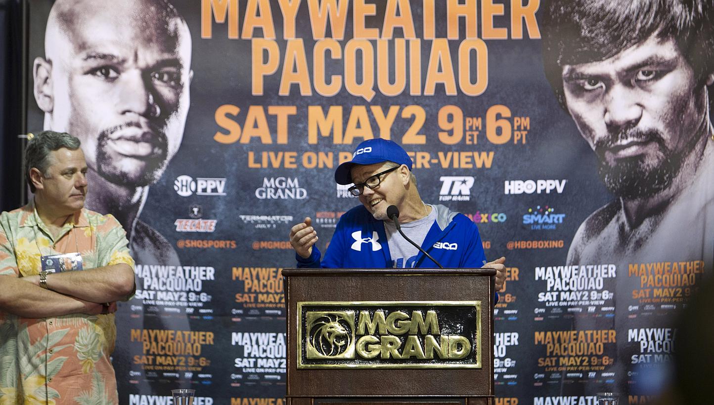 Manny Pacquiao's trainer Freddie Roach responds to a reporter's question at the MGM Grand Resort in Las Vegas, Nevada April 30, 2015. Top Rank publicist Fred Sternberg listens at left.&nbsp;While trash-talking by the two fighters has been at a bare m
