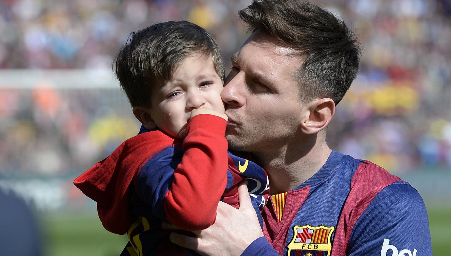 Barcelona's Argentinian forward Lionel Messi holds his son Thiago Messi before playing against Rayo Vallecano on March 8, 2015. Barcelona superstar Lionel Messi announced on Thursday he is to be a father again by posting a picture of his pregnant par