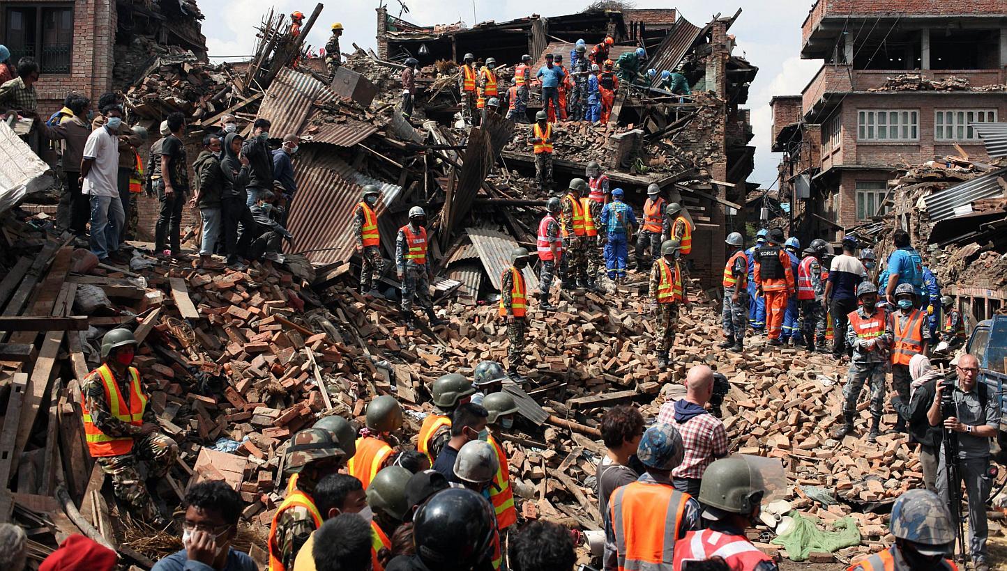 This handout photo taken on April 29, 2015, and released by the International Federation of Red Cross and Red Crescent Societies (IFRC) shows workers taking part in a rescue operation at Kolache-2 in Bhaktapur near Kathmandu, four days after the 7.8 