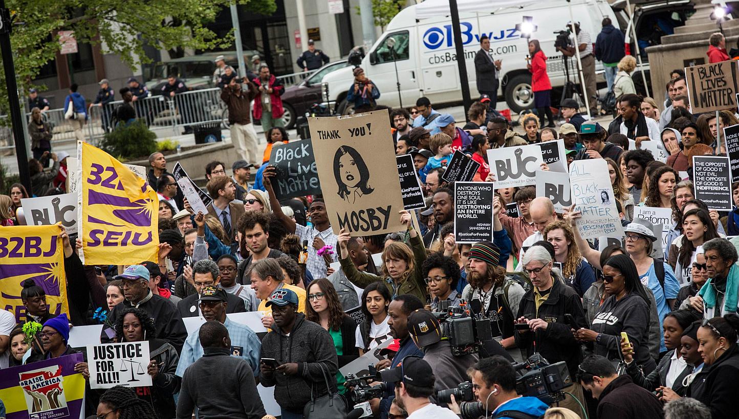 Protesters marching through the streets on May 1, 2015, in Baltimore, Maryland, despite the announcement that charges would be filed against Baltimore police officers in the death of Freddie Gray. -- PHOTO: AFP &nbsp;