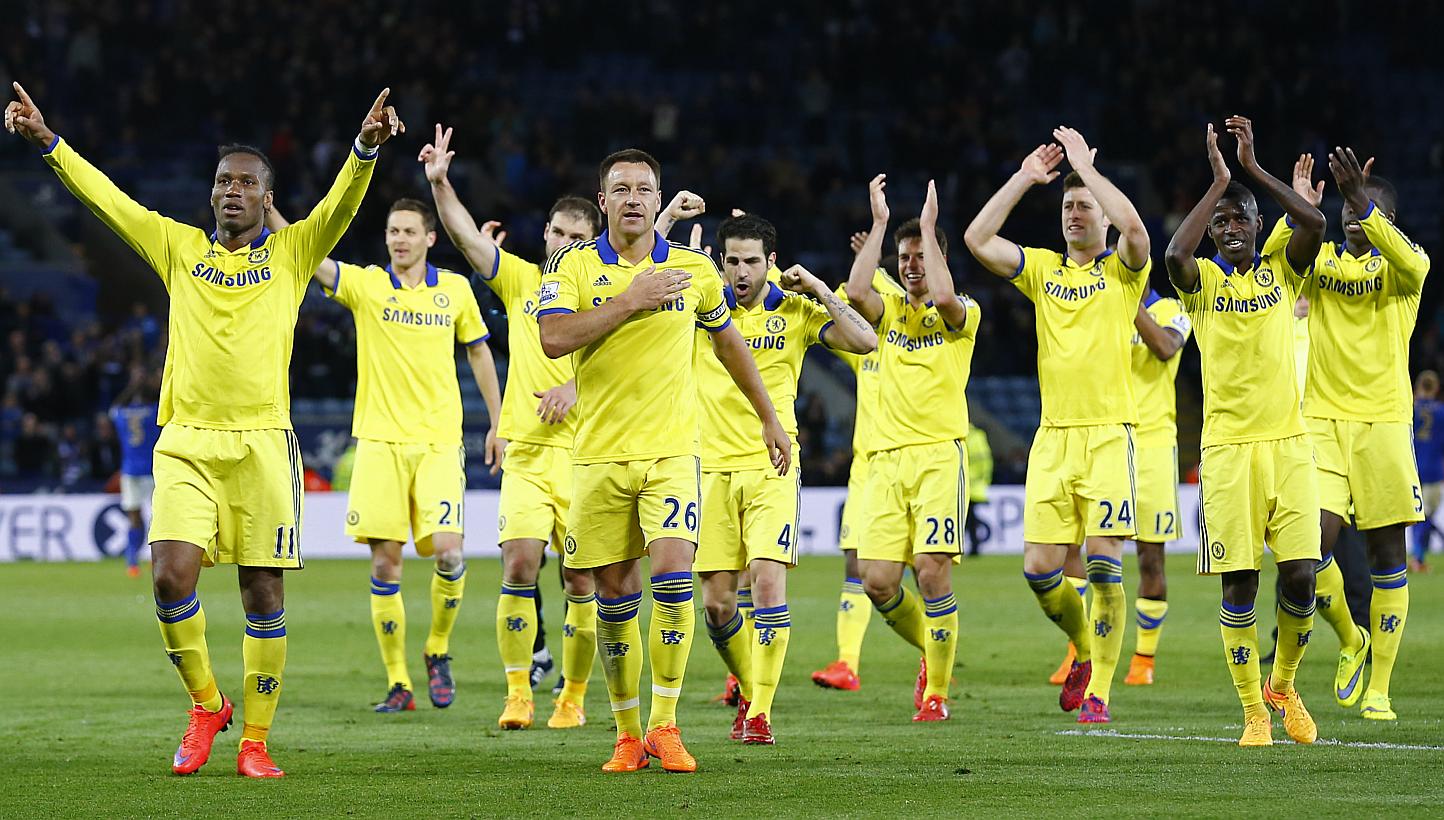 Chelsea's Didier Drogba and John Terry celebrate with team mates at the end of a match against Leicester City, on April 29, 2015. -- PHOTO: REUTERS