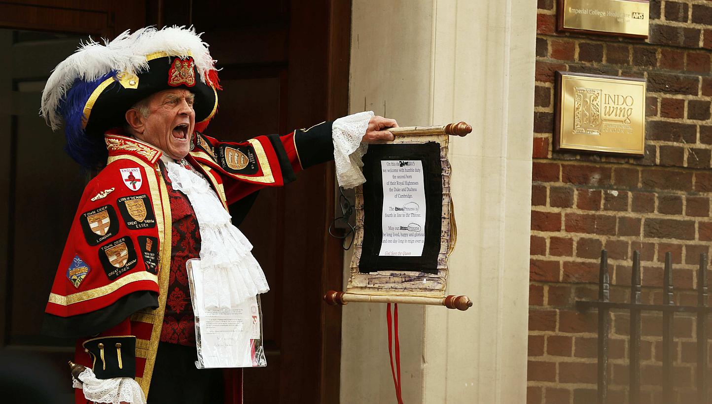 A ceremonial town crier holds a scroll after announcing the birth of a baby girl to royal fans and members of the media outside the entrance to the Lindo wing of St Mary's Hospital in London, Britain on&nbsp;May 2, 2015. The birth of Britain's royal 