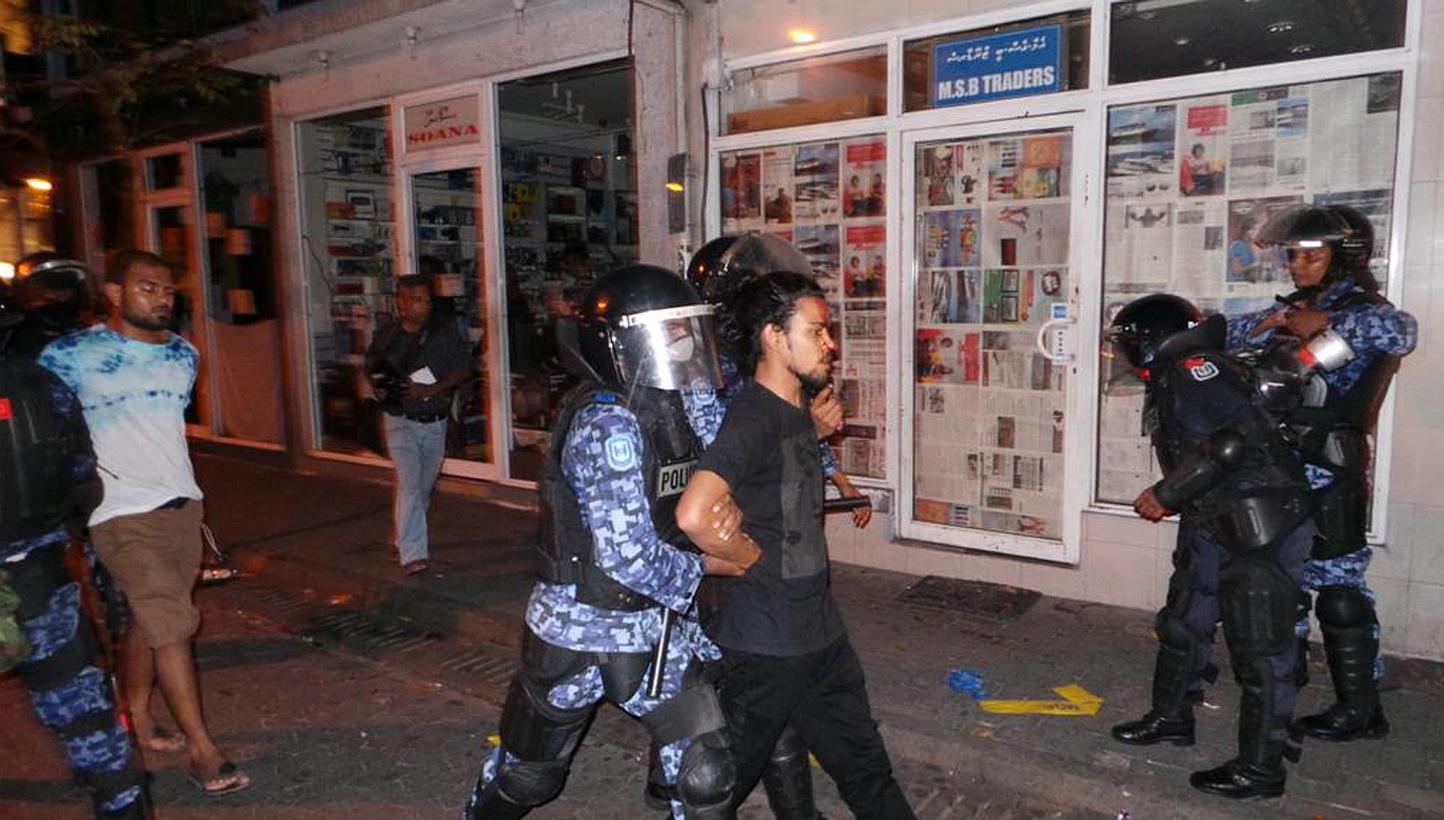Maldives security personnel arrest opposition activists during an anti-government rally in Male, Maldives, on May 2, 2015. -- PHOTO: EPA