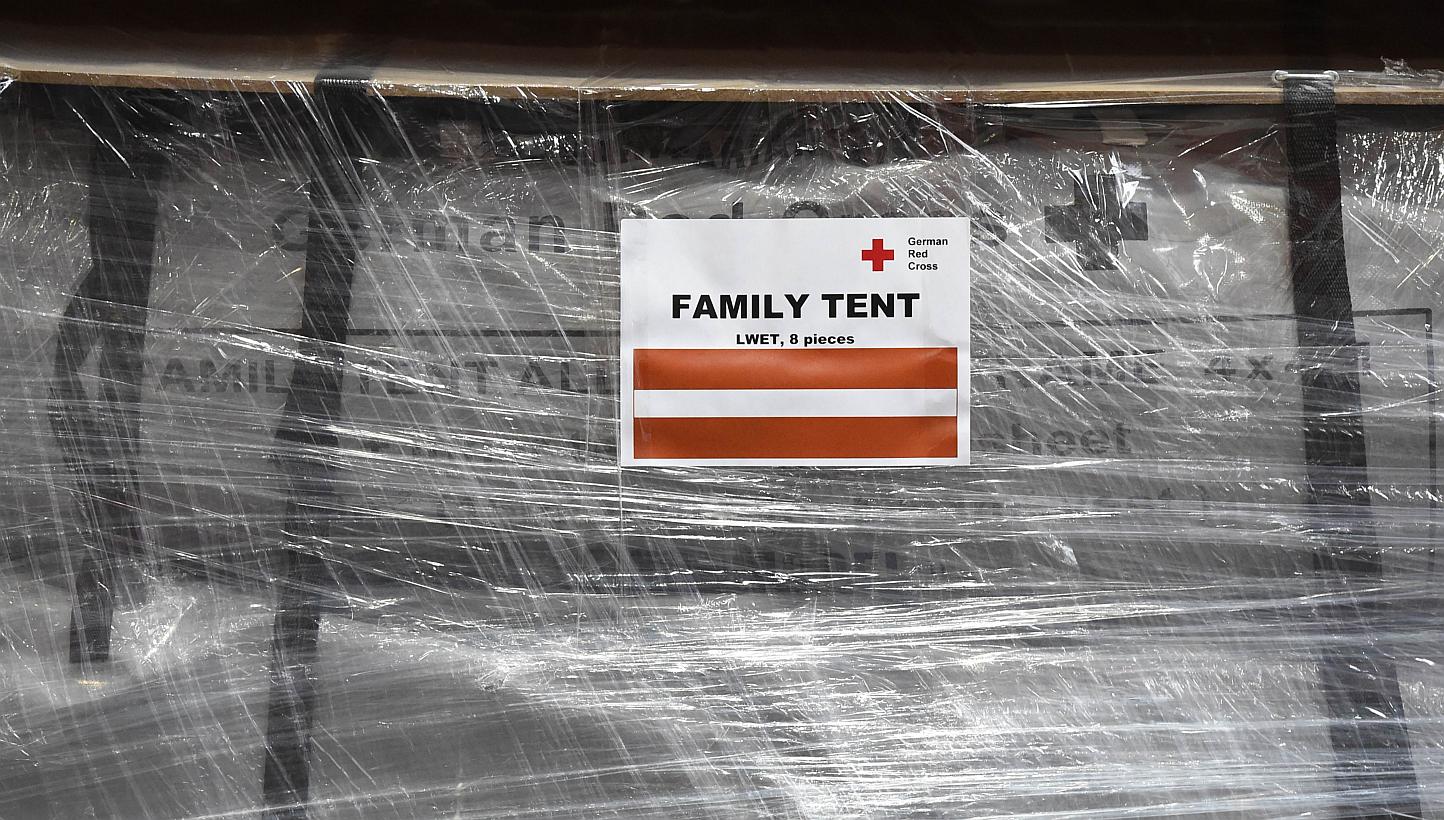 A wrapped family tent is seen at the logistics centre of the German Red Cross (DRK) at the Schoenefeld airport near Berlin, on April 27, 2015. Some of the relief goods were held up at Nepal's only international airport because of customs bottlenecks,