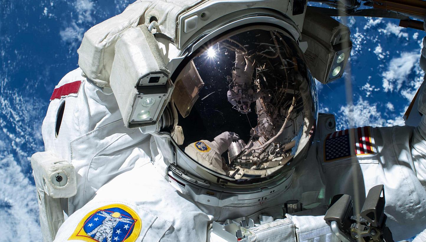 Nasa astronaut Barry "Butch" Wilmore is pictured as the Earth's surface passes by in the background on the International Space Station, in this handout photo taken Feb 21, 2015, provided by Nasa.&nbsp;Flying people to deep space - like Mars or an ast