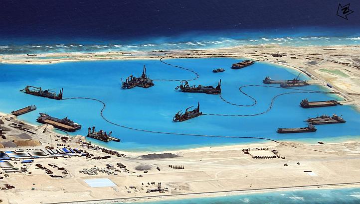 A handout picture made available by the Philippines armed forces on April 20, 2015 shows construction at Kagitingan (Fiery Cross) Reef in the disputed Spratley Islands in the South China Sea by China on Feb 18 2015. -- PHOTO: EPA