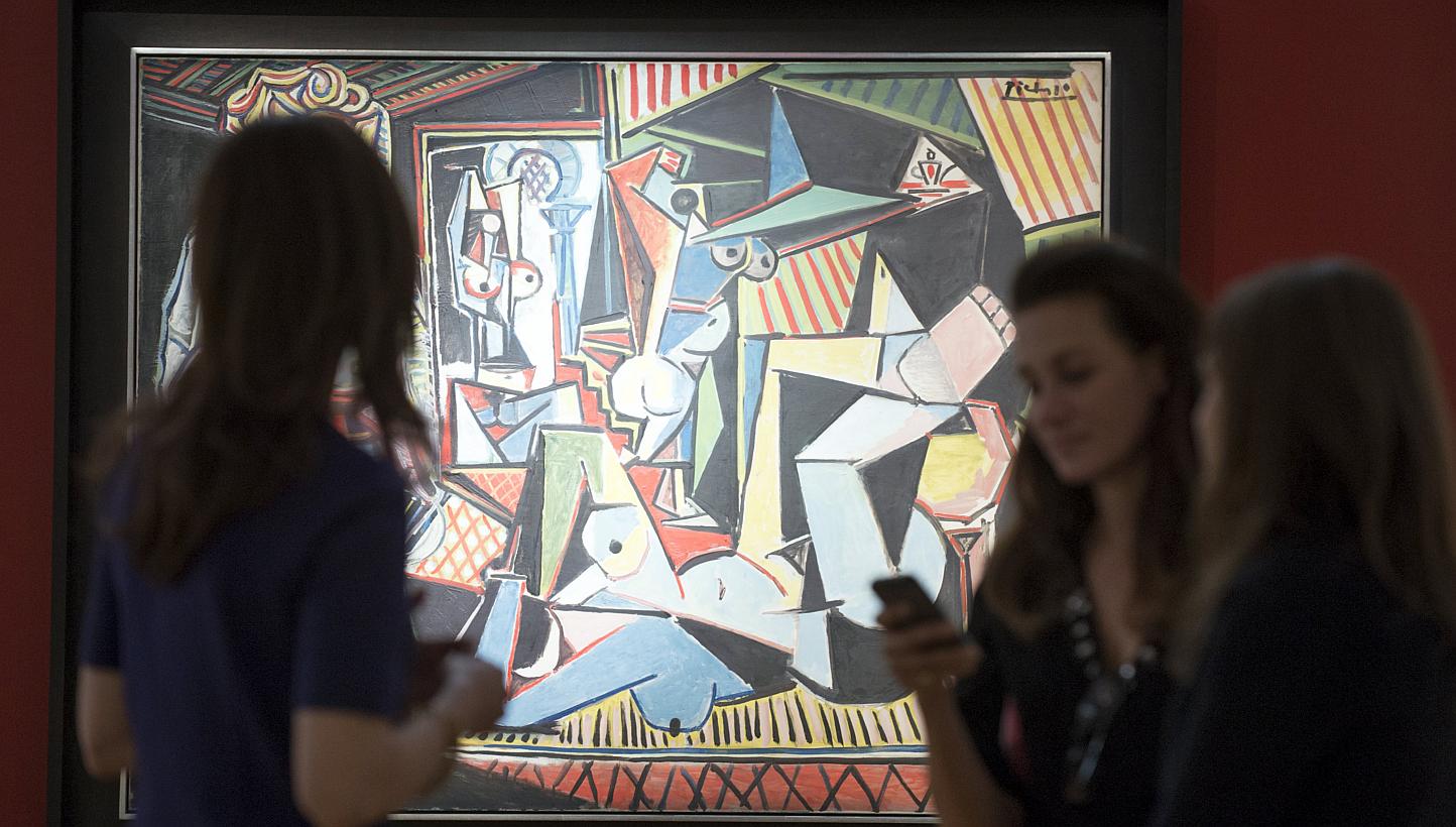 People look at Pablo Picasso's "Les femmes d'Alger (Version 'O')" (Women of Algiers), estimated at US$140 million, ahead of a preview event to Christie's upcoming impressionist, modern and contemporary art sale in Manhattan on May 1, 2015. -- PHOTO: