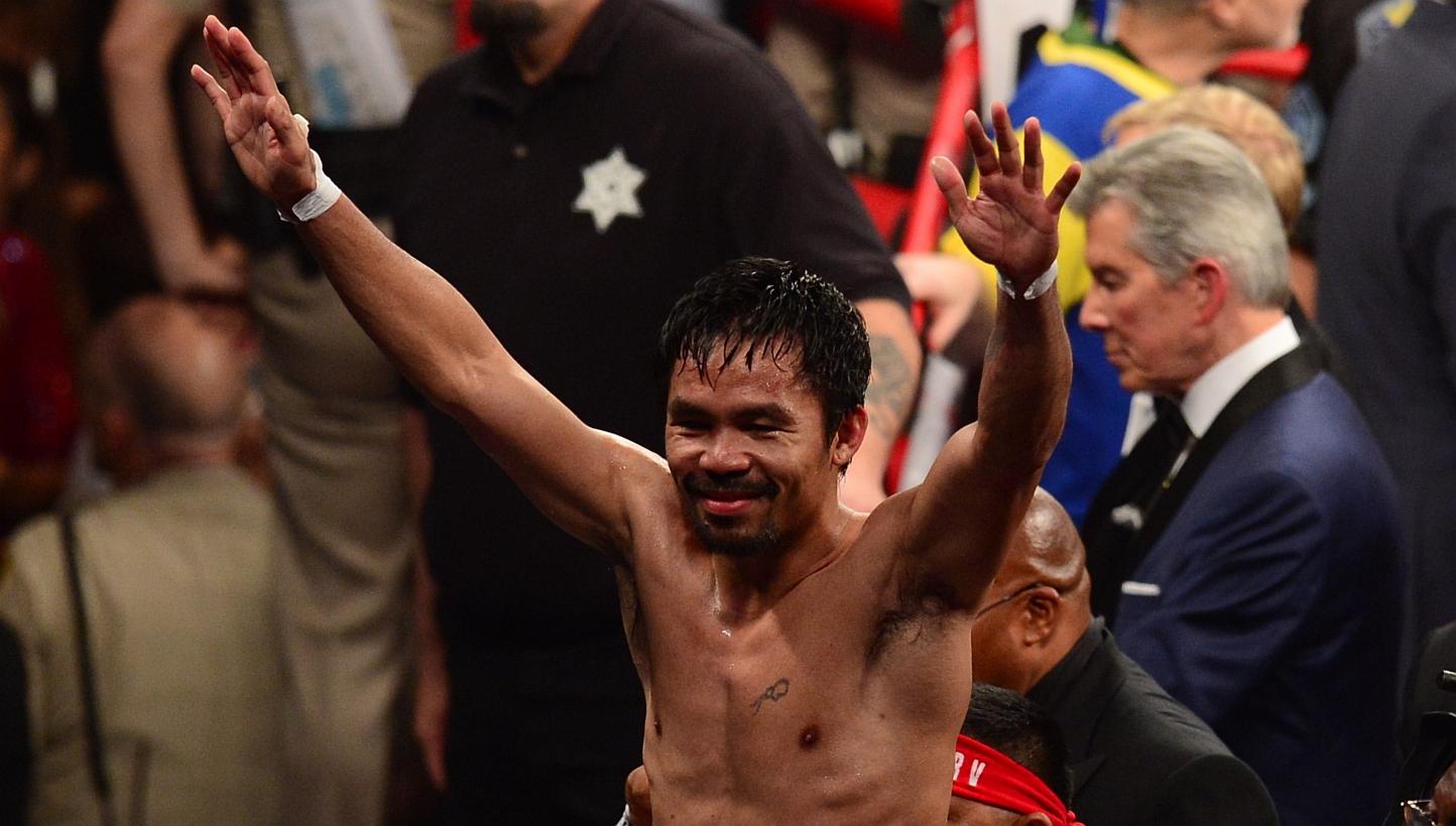 Manny Pacquiao reacts after his fight against Floyd Mayweather Jr. in a welterweight unification bout on May 2, 2015 at the MGM Grand Garden Arena in Las Vegas, Nevada. -- PHOTO: AFP
