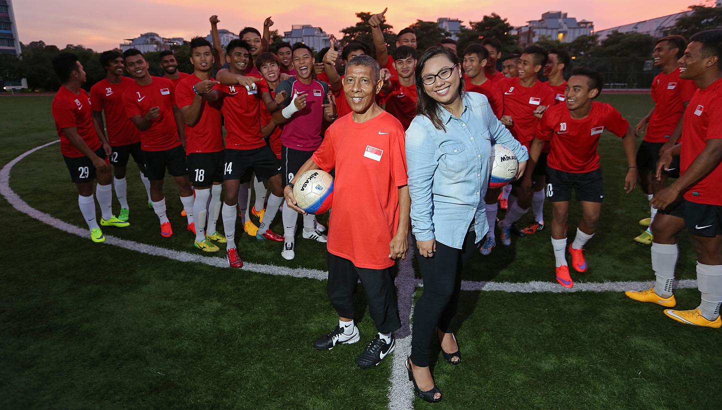 Kit man Zainol Abidin Omar, 56, and his daughter Nurul Jannah, 25, with the national Under-23 team. Mr Zainol was diagnosed with liver cancer last year but Ms Nurul donated 70 per cent of her liver to him. Now, he is back in action.