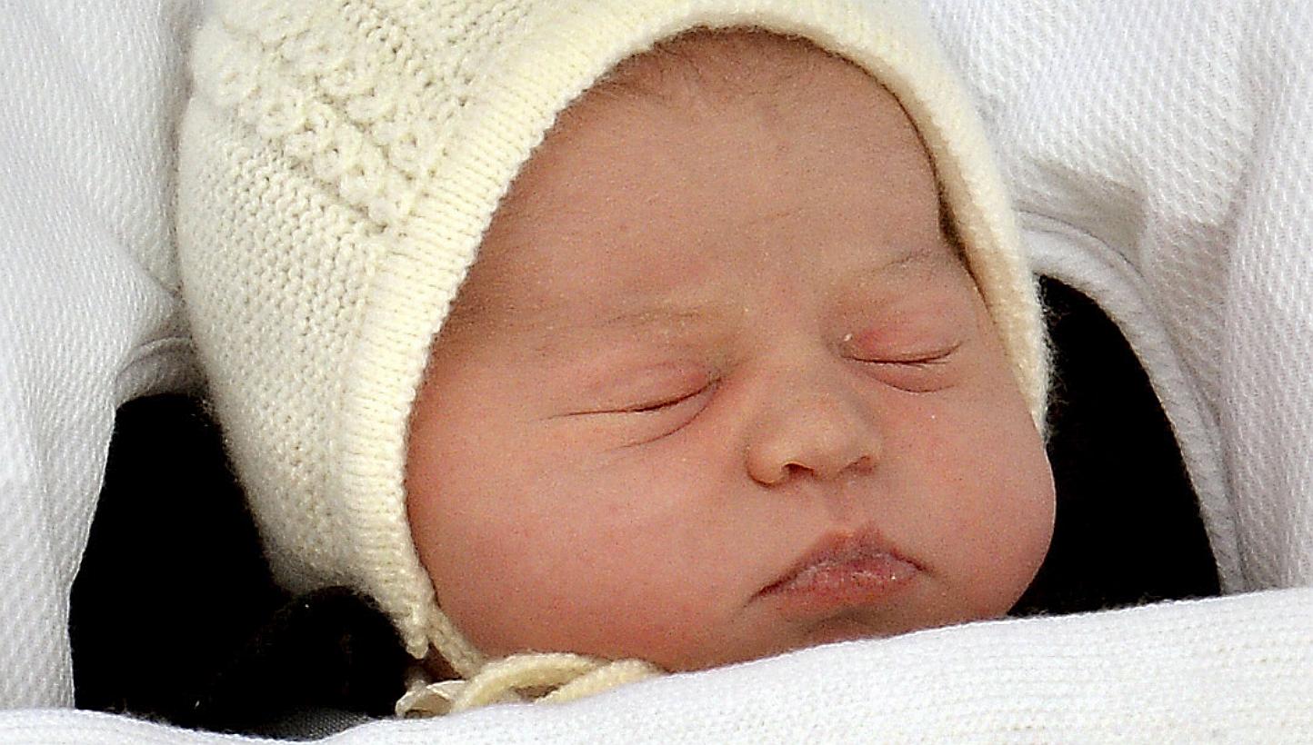 The baby daughter of Britain's Prince William and Catherine, Duchess of Cambridge, sleeps as she is carried in a car seat from the Lindo Wing of St Mary's Hospital, in London, May 2, 2015. -- PHOTO: REUTERS 