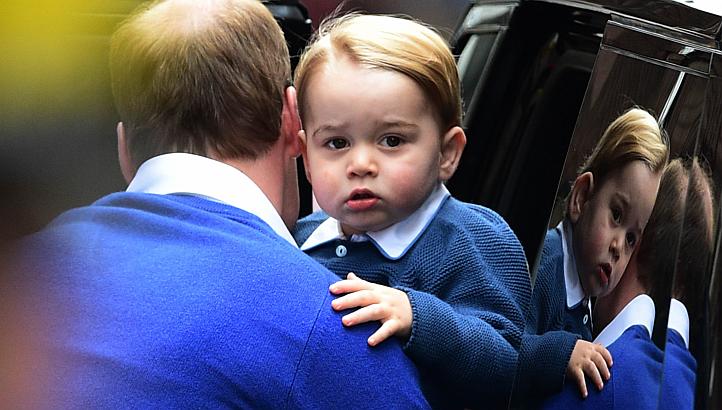 Britain's Prince William helps his son Prince George out of a car as they return to the Lindo Wing at St Mary's Hospital in central London, on May 2, 2015, where his wife Catherine gave birth to their second child, a baby girl, earlier in the day. --