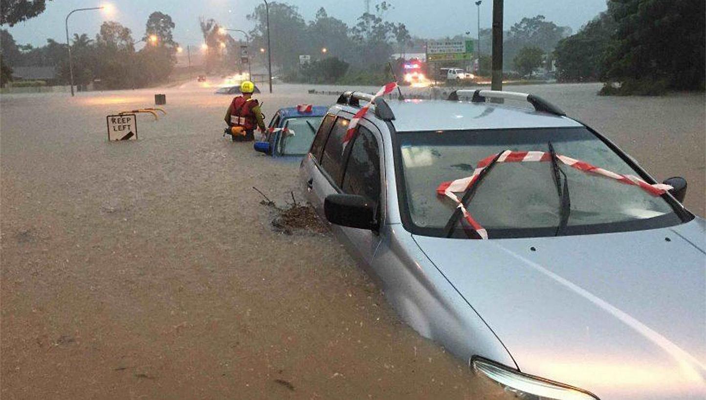 Swift water operators assessing vehicles submerged in floodwaters in Brisbane, Australia, on May 1, 2015.&nbsp;The death toll from heavy rains that inundated Australia's east coast has climbed to six, as flood warnings continued Sunday following a se