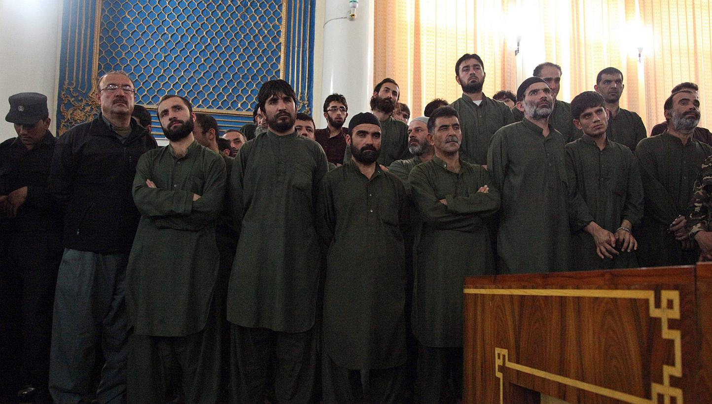 Unidentified suspects linked to the mob killing of a woman in the Afghan capital of Kabul attend their primary court trial in Kabul, Afghanistan on May 2, 2015. -- PHOTO: EPA