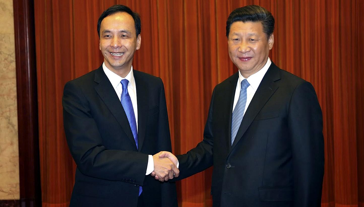 A handout photo released by Taiwan's ruling party the Chinese Nationalist Party (Kuomintang or KMT), shows Chinese President Xi Jinping (right), in his capacity as secretary-general of the Chinese Communist Party, meeting with KMT Chairman Eric Chu (