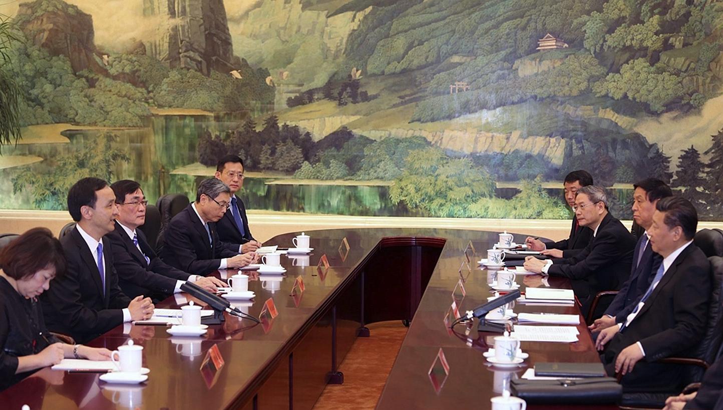 A handout photo released by Taiwan's ruling party the Chinese Nationalist Party (Kuomintang or KMT), shows Chinese President Xi Jinping (right), in his capacity as secretary-general of the Chinese Communist Party, meeting with KMT Chairman Eric Chu (