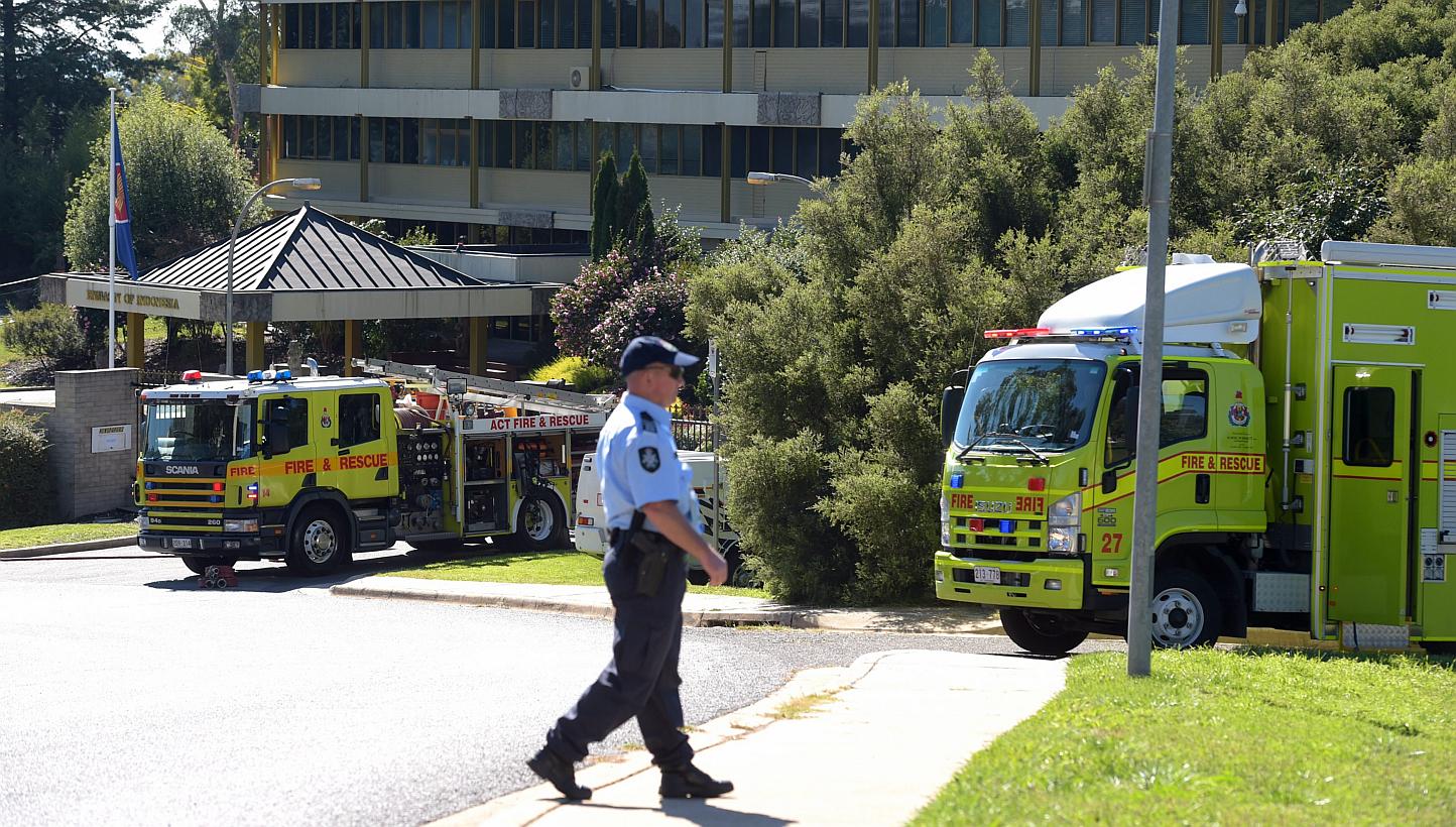 Two Hazardous Materials (HAZMAT) teams of the Canberra fire brigade respond to a suspicious package at the Indonesian Embassy in Canberra, Australia, on May 4, 2015. -- PHOTO: EPA