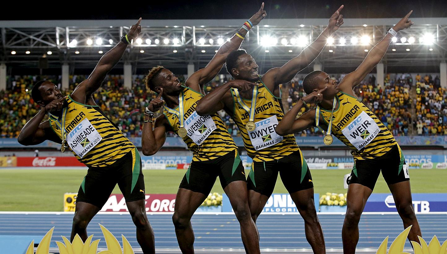 Jamaica's 4x200 relay team strike a pose on the medal podium after winning the event at the IAAF World Relays Championships in Nassau Bahamas on May 3, 2015. From left are Nickel Ashmeade, Jason Livermore, Rasheed Dwyer and Warren Weir. -- PHOTO: REU