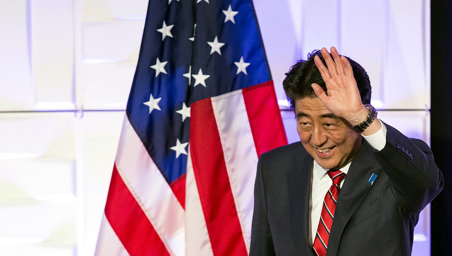 Japan's Prime Minister Shinzo Abe waves after speaking at a luncheon at the Japan-US Economy Forum in Los Angeles, California, on May 1, 2015. South Korean President Park Geun Hye said Mr Abe missed an opportunity to improve ties between their countr