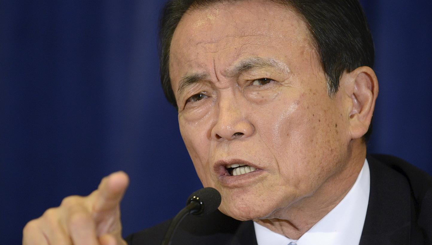 Japan's Finance Minister and Deputy Prime Minister Taro Aso makes remarks during a news conference in Washington last month. -- PHOTO: &nbsp;REUTERS