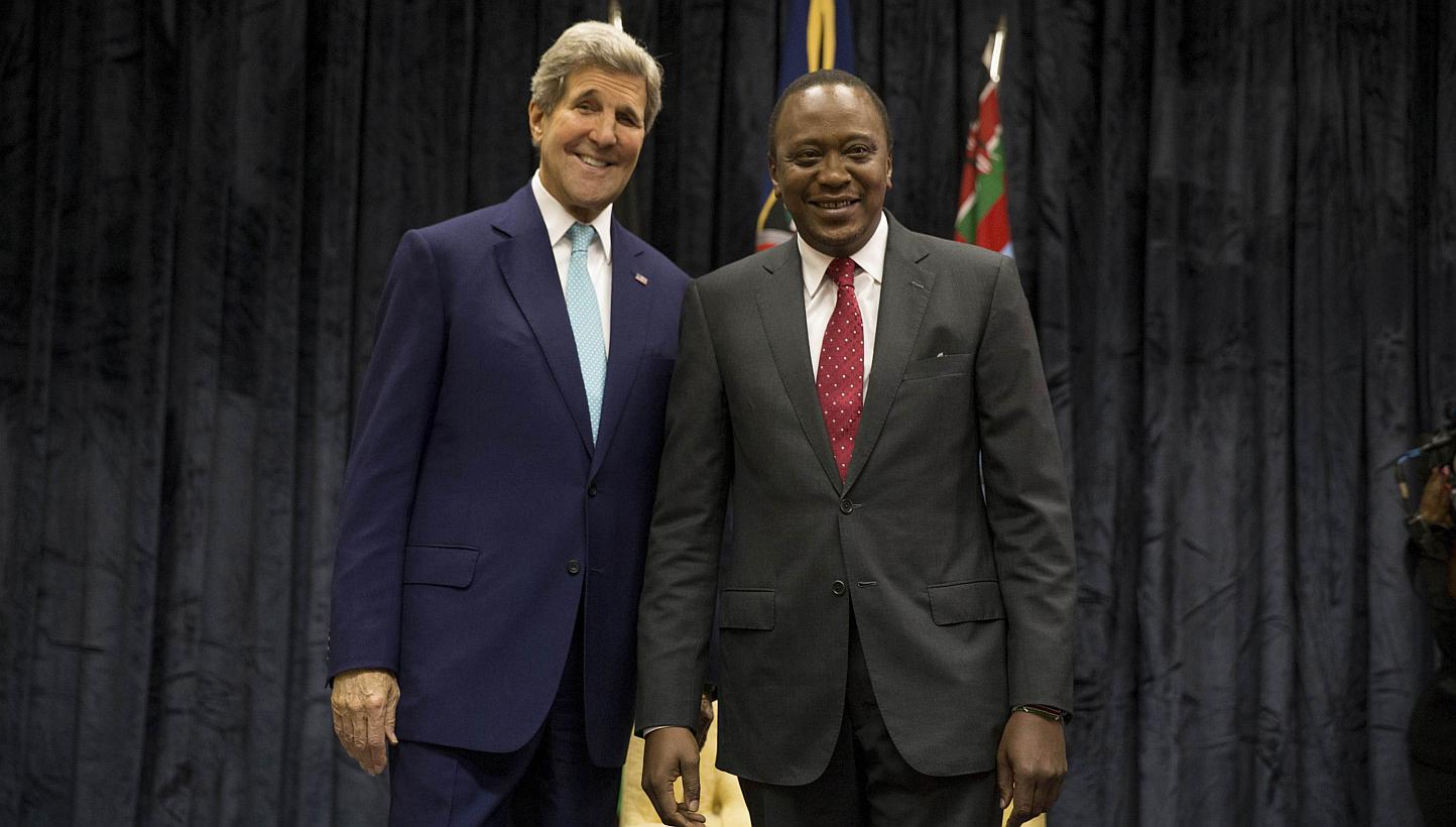 US Secretary of State John Kerry (left) poses for a photograph with Kenyan President Uhuru Kenyatta at the State House, in Nairobi, on May 4, 2015. -- PHOTO: AFP