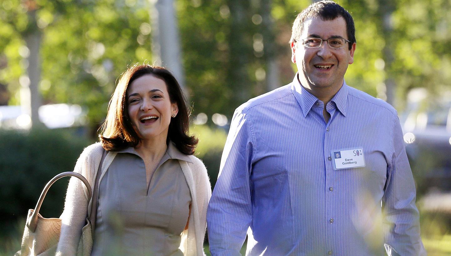 Sheryl Sandberg, (left), Chief Operating Officer (COO) of Facebook, arriving with her husband David Goldberg, CEO of SurveyMonkey, for the first day of the Allen and Co. media conference in Sun Valley, Idaho on July 9, 2014. Goldberg died Friday from