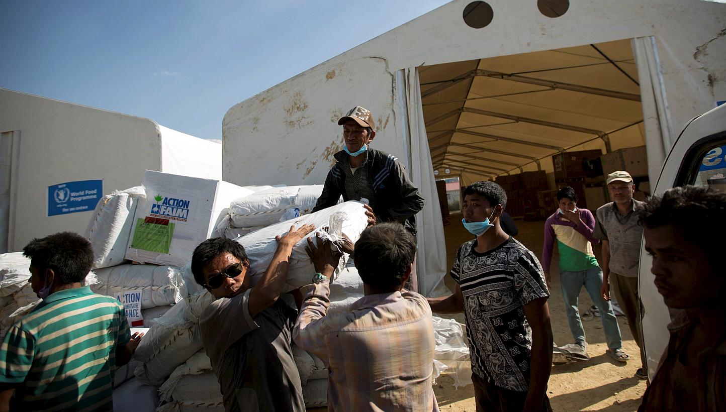 Workers loading relief material onto a truck for earthquake victims at the cargo terminal of international airport in Kathmandu, Nepal on May 3, 2015. -- PHOTO: REUTERS