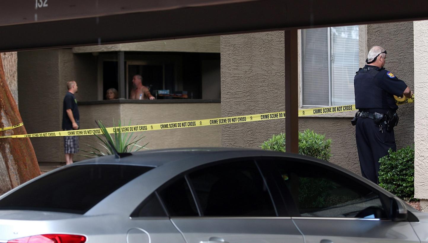 Phoenix Police set up crime tape near the home of one of the gunmen who opened fire at a Muhammad Art Exhibit and Contest the day before in Texas, at an apartment complex in Phoenix, Arizona on Monday. -- PHOTO: EPA