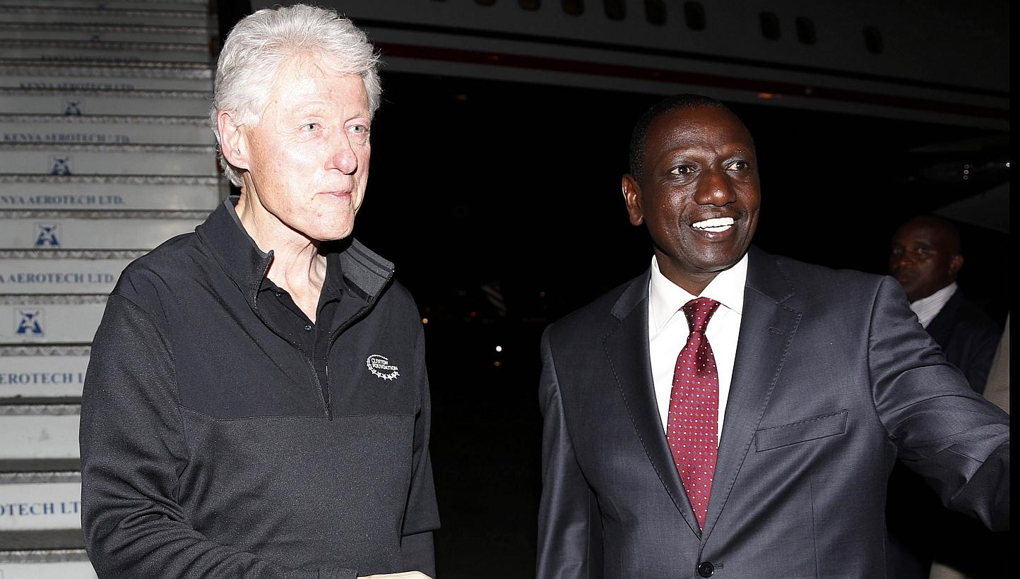 Kenya's Deputy President William Ruto (right) welcoming former US President Bill Clinton last week as he arrived at Jomo Kenyatta International Airport in Nairobi. -- PHOTO: AFP