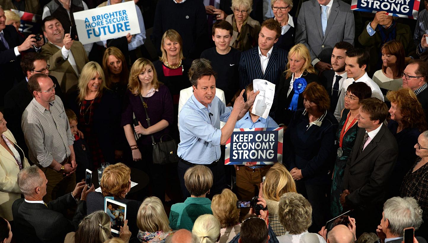 British Prime Minister David Cameron (centre) campaigns at a rally in St Ives, Cornwall, as part of his 36 hour non-stop tour of the UK, Britain, on May 5, 2015. -- PHOTO: EPA&nbsp;