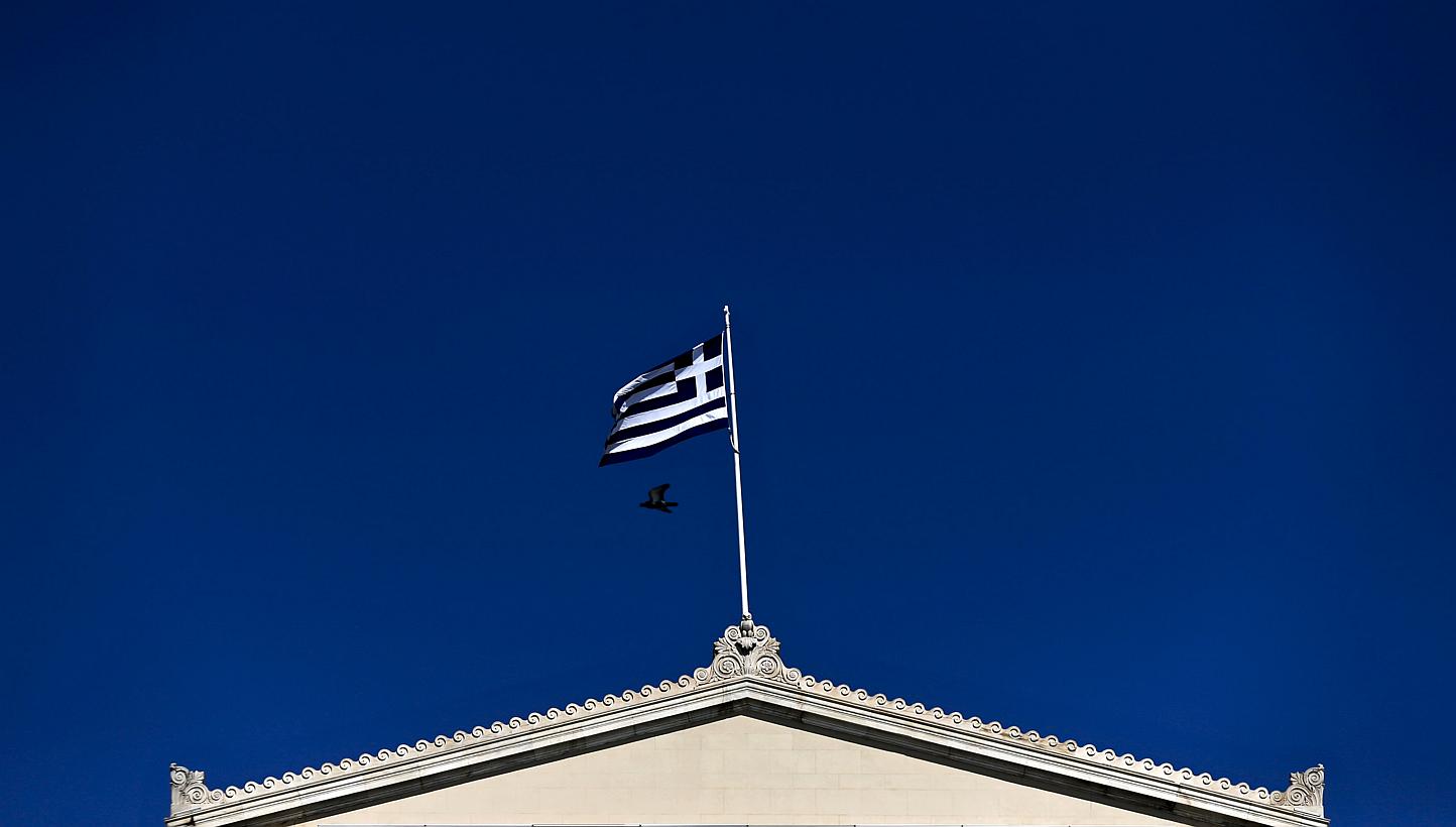 A Greek national flag flying atop the Parliament building in Athens on May 5, 2015. The Greek government has suggested imposing a special levy on the country's 500 richest families to help unlock bailout aid, German newspaper Bild said on Wednesday. 