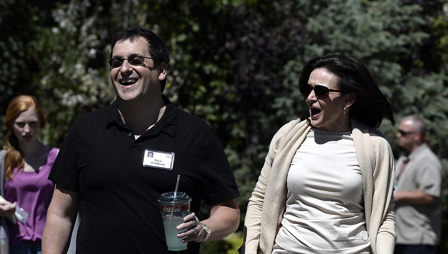 Sheryl Sandberg, chief operating officer of Facebook, and husband David Goldberg (left), chief operating officer of SurveyMonkey, attending the Allen and Company 31st Annual Media and Technology Conference. Sandberg re-emerged in public on Tuesday af