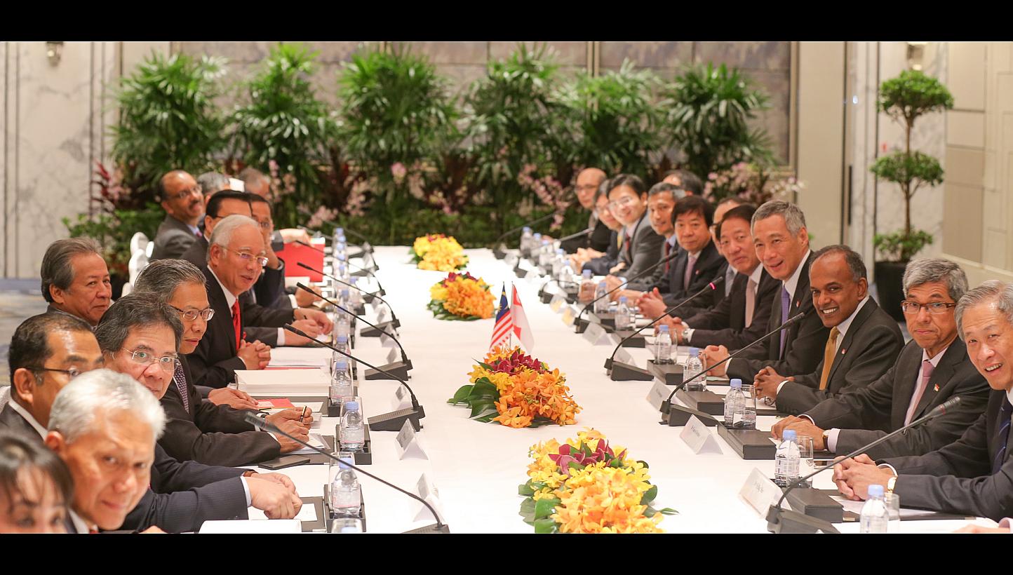 50 YEARS OF SINGAPORE-MALAYSIA TIES: The Malaysian delegation (left) led by PM Najib Razak (wearing red tie) and the Singapore delegation (right), led by PM Lee Hsien Loong, at the Shangri-La Hotel yesterday.