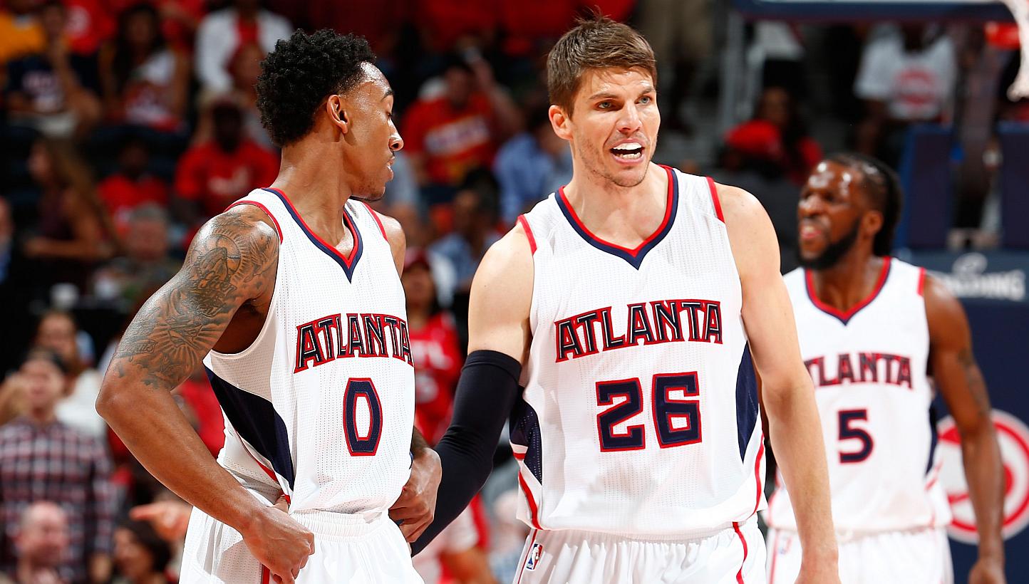 Kyle Korver (centre) of the Atlanta Hawks converses with Jeff Teague (left) during Game Two of the Eastern Conference Semifinals against the Washington Wizards at the Philips Arena, Atlanta, Georgia, on May 5, 2015. -- PHOTO: AFP &nbsp;