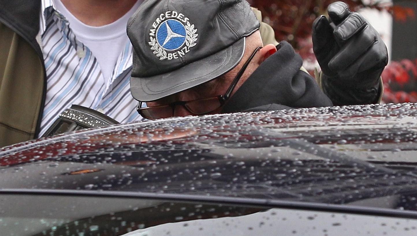 Andreas H., suspected of being a member of a right-wing extremist group, is moved to a different location by investigators after being taken into custody in Augsburg, German on Wednesday. -- PHOTO: EPA