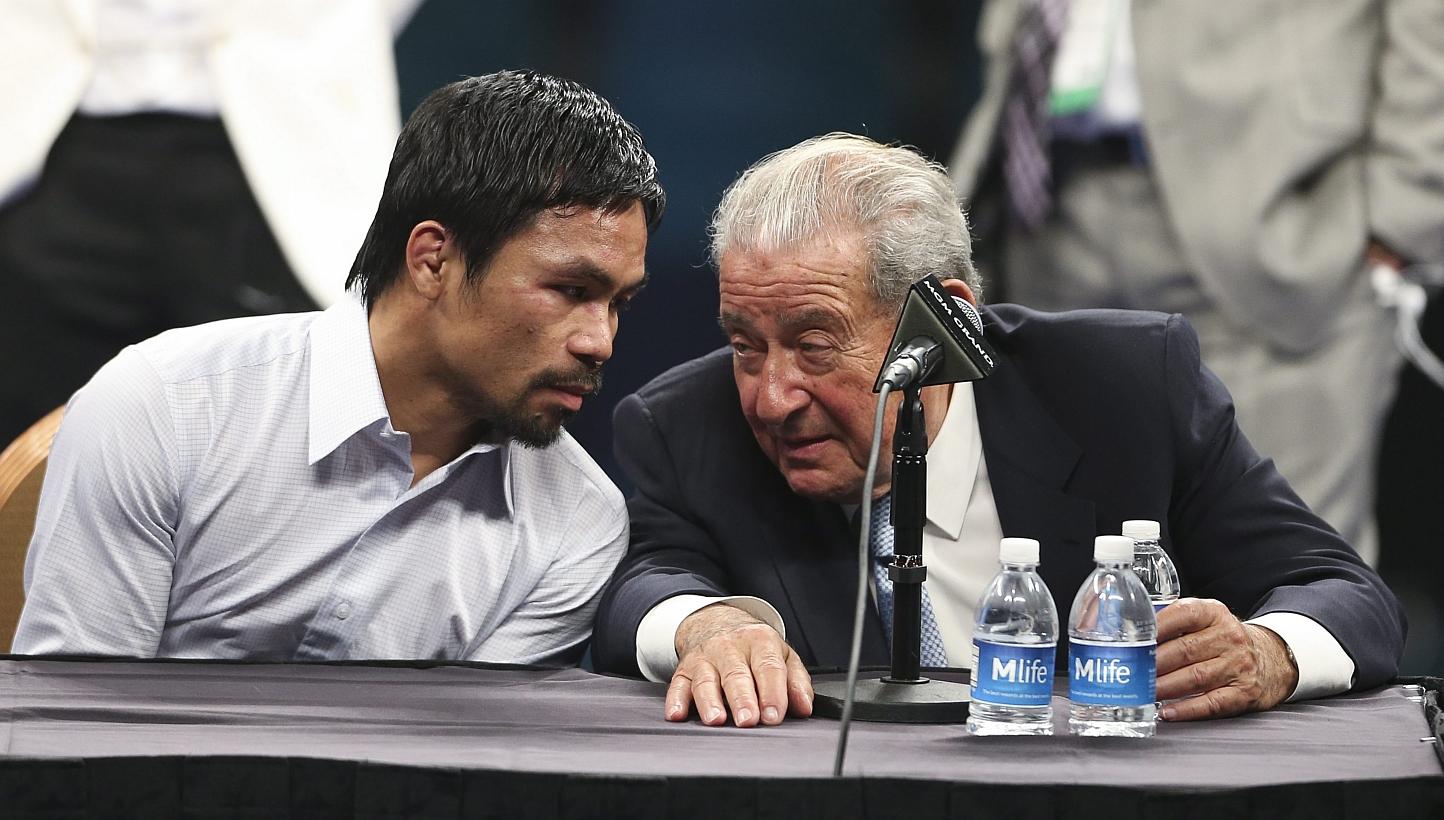 Boxing Promoter Bob Arum (right) with Manny Pacquiao (left) attending a press conference after Pacquiao's defeat by Floyd Mayweather Jr. &nbsp;following their welterweight unification championship boxing fight at the MGM Grand Garden Arena in Las Veg
