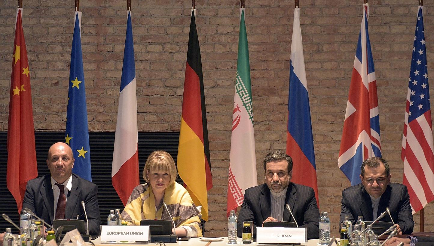 EU-director Helga Schmid (centre left) and Iranian Deputy Foreign Minister Abbas Araghchi (centre right), during talks between France, Germany, Britain, China, Russia, the United States and Iran in Vienna on 24 April 2015. -- PHOTO: EPA